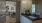 dimly lit bathroom with a large mirror
